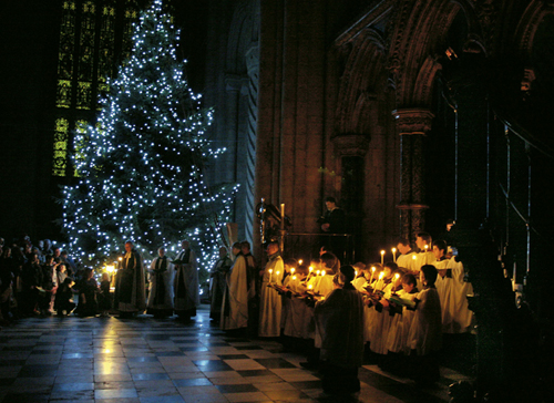  A candle-lit carol-service around the Christmas tree. 